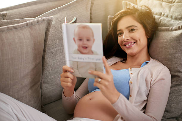 istock Reading a best seller baby book 487537766