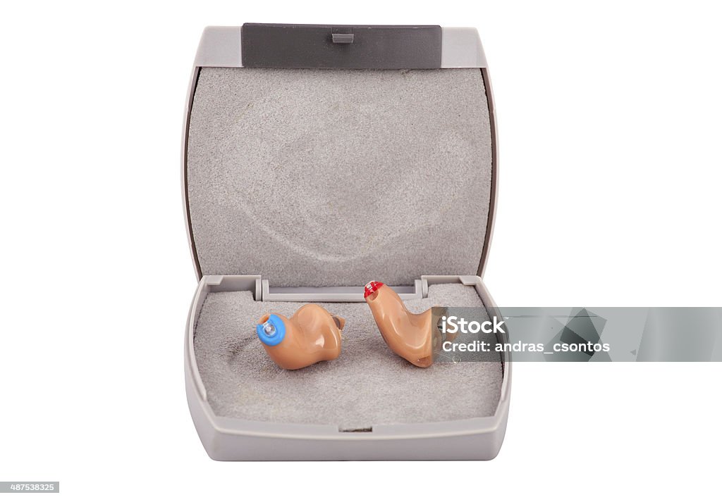 CIC hearing aids CIC (completely in the ear) Hearing aids with box .Isolated on white. Audiologist Stock Photo