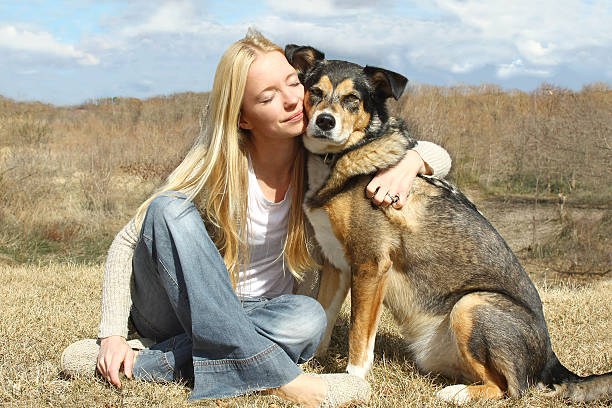 istock Woman Hugging German Shepherd Dog Outside 487538481