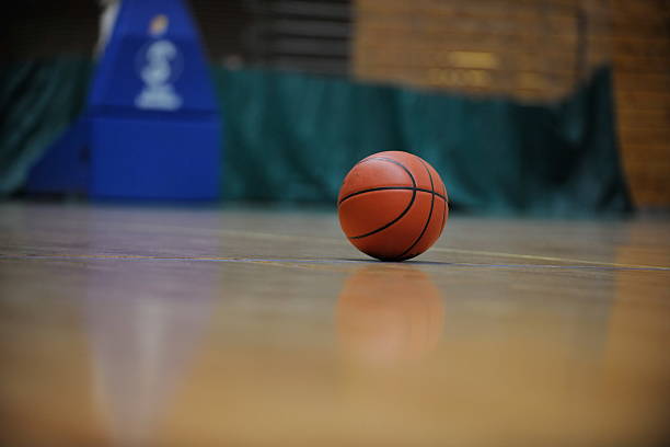 istock basketball ball and net on black background 487538651