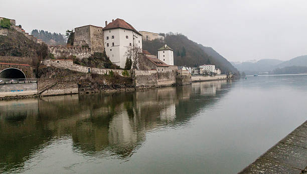 The medieval fortress of Veste Oberhaus sits on the edge of the Danube River at Passau, Germany in December.