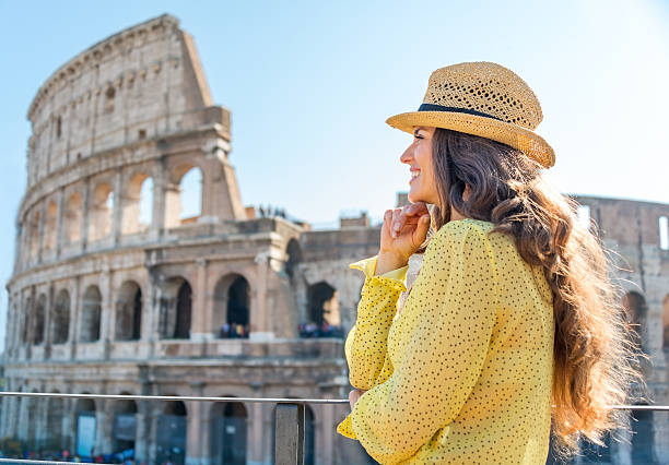 istock Woman standing and looking into distance in Rome 487542388