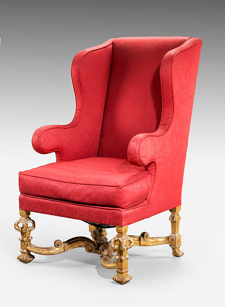 istock Large red wing chair upholstered in red old antique 487542400