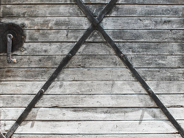 istock Wood wall texture background with x cross 487543340