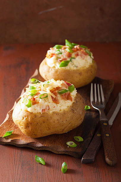 istock baked potato in jacket with bacon and cheese 487548992