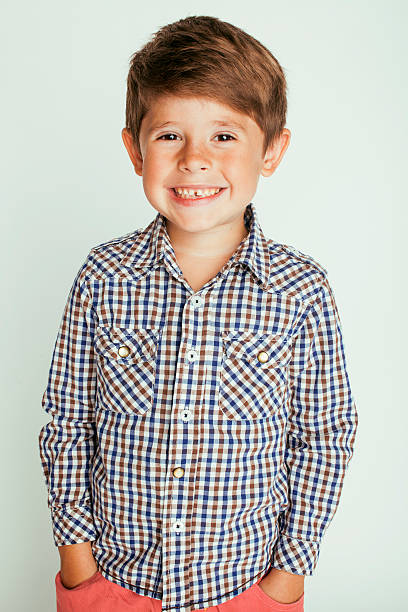 istock little cute boy on white background gesture smiling close up 487549650