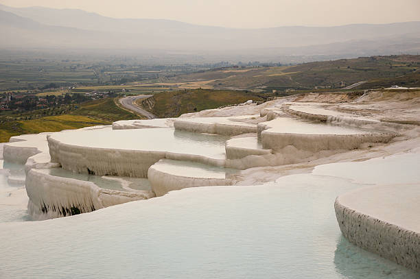 Travertine terraces filled with water stock photo