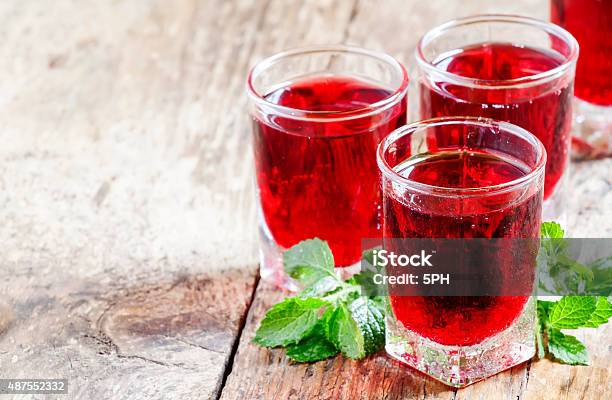 Pomegranate Red Cocktail With Mint Stock Photo - Download Image Now - 2015, Alcohol - Drink, Close-up