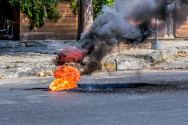istock Broken Natural Gas Pipeline on asphalt - Fire 487552740