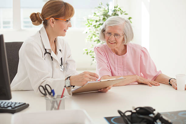 istock Elderly woman visiting doctor. 487553065