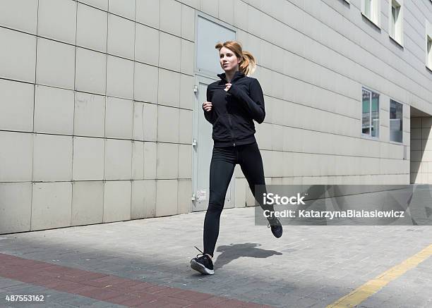 Woman Running In The City Stock Photo - Download Image Now - 2015, Active Lifestyle, Activity