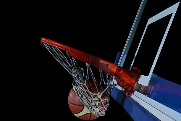 istock basketball ball and net on black background 487553343