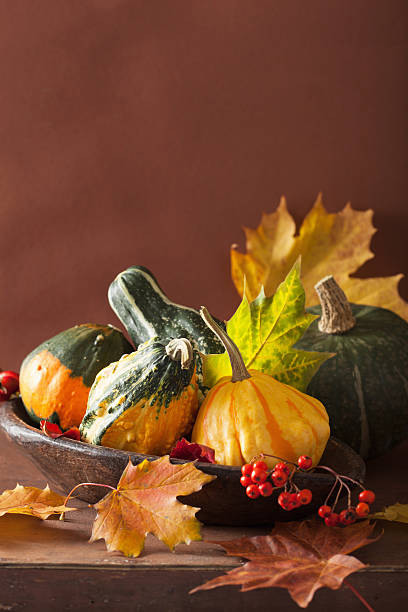 istock decorative pumpkins and autumn leaves for halloween 487553700
