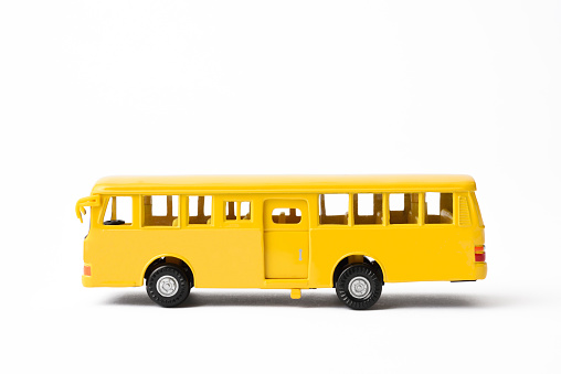 Side view of yellow School bus isolated on white background with clipping path.