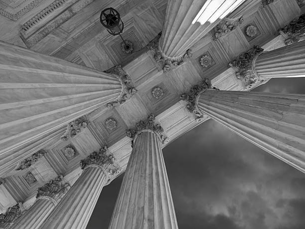 istock US Supreme Court Columns and Storm in Black and White 487554630