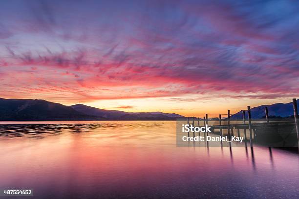 Stunning Vibrant Sunset With Jetty Pier In The Lake District Stock Photo - Download Image Now