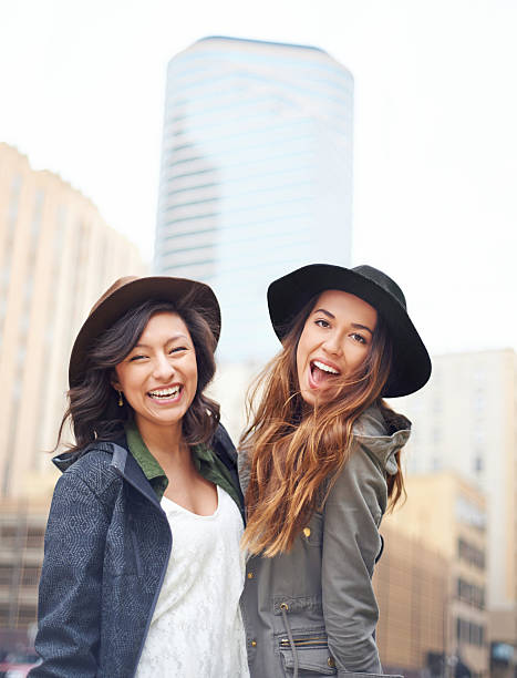 Portrait of two young friends enjoying a day around townhttp://195.154.178.81/DATA/i_collage/pu/shoots/805499.jpg