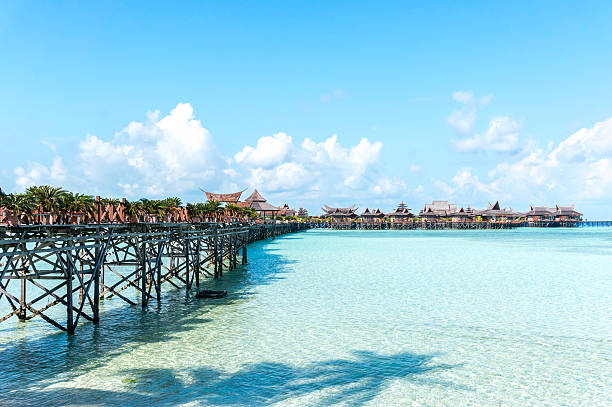 Jetty Jetty with blue skies mabul island stock pictures, royalty-free photos & images