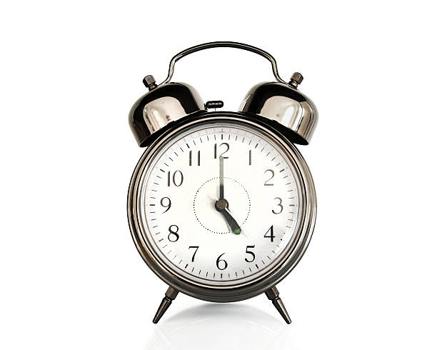 istock Five on an old vintage alarm clock isolated on white 487556380