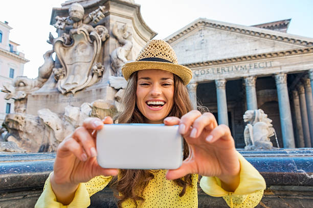 istock Woman laughing as she is checking her photo at Pantheon 487556532
