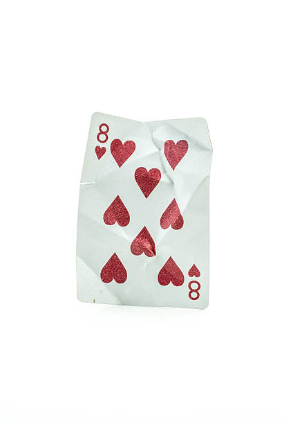 istock King of Spades Crumpled Playing Cards on white background 487557546
