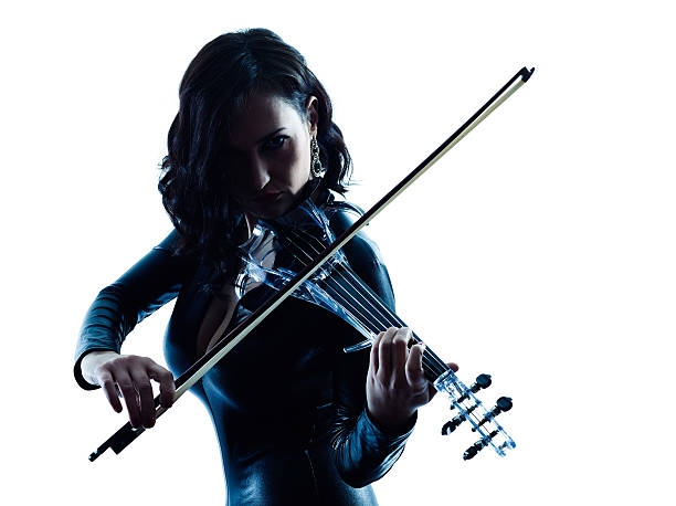 istock Violinist woman slihouette isolated 487560818