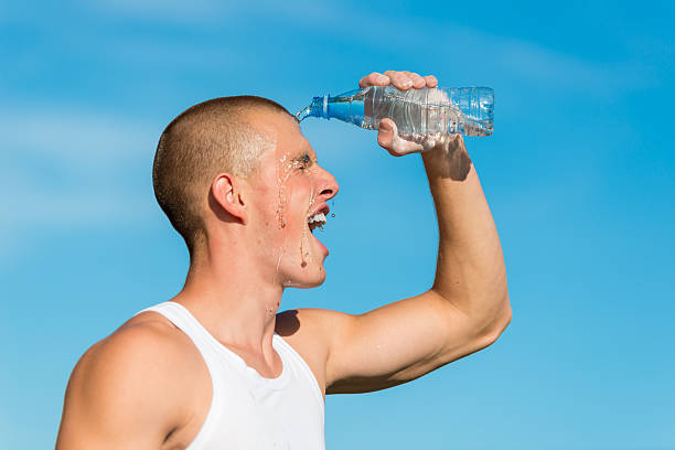 istock Male Athlete Cooling Off With Water 487563168