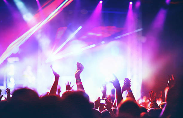istock People at concert party. 487563188