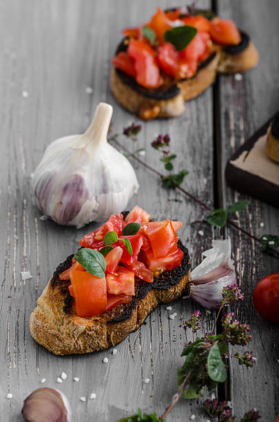istock Bruschetta with tomatoes, garlic and herbs 487563682