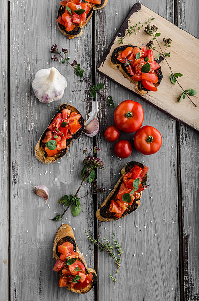 istock Bruschetta with tomatoes, garlic and herbs 487563694