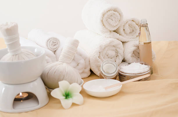 istock Spa treatment with towels and herbal creams 487565100