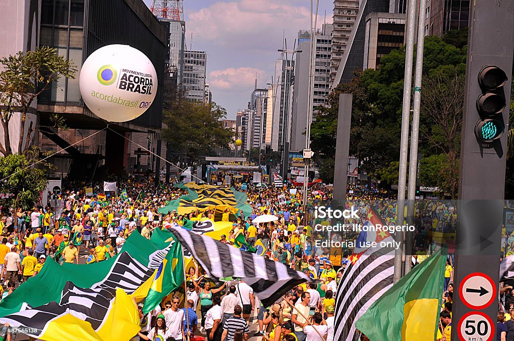 Pro impeachment manifestation Dilma Rousseff Sao Paulo, Brazil - August 16, 2015: Crowd of people holding flags and banners in protest against corruption in the Avenida Paulista in Sao Paulo, Brazil. 2015 Stock Photo