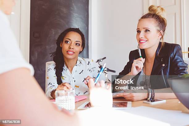 Women Discussing In An Office Stock Photo - Download Image Now - New Business, 2015, Adult