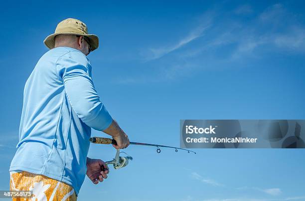 Man With Hat Fishing Stock Photo - Download Image Now - Fishing, Sea, Adult