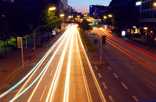 istock Light trails of night traffic in modern city 487568174