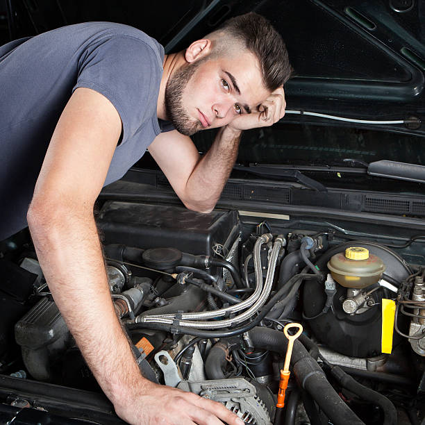 istock Mechanic car repair engine motor 487568612
