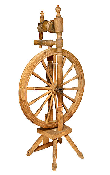 istock Old Wooden spinning Wheel isolated on white background 487569384