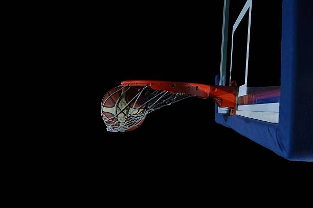 istock basketball ball and net on black background 487569629