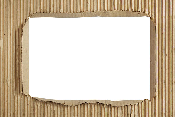 istock Square hole in a sheet of corrugated cardboard 487569649