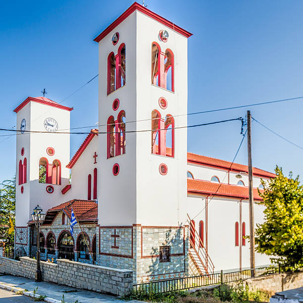 istock Belfry and Greek old church with cross and Wall Clock 487569694