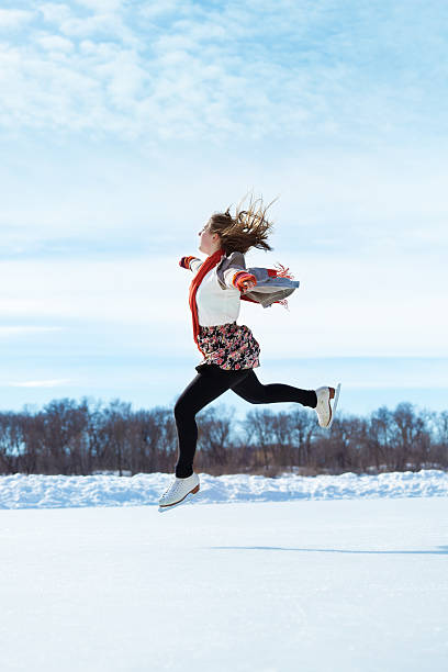 portrait of a cheerful woman with ice skates on a frozen lake  in winter nature. Enjoying the little things. Winter Vibes. christmas holiday