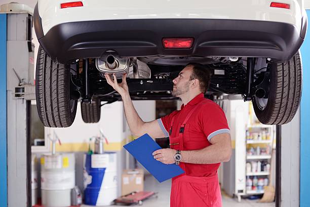 inspection of car mechanic have inspection of car exhaust pipe photos stock pictures, royalty-free photos & images