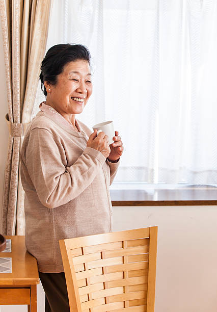 istock Old woman relaxing at home 487570527