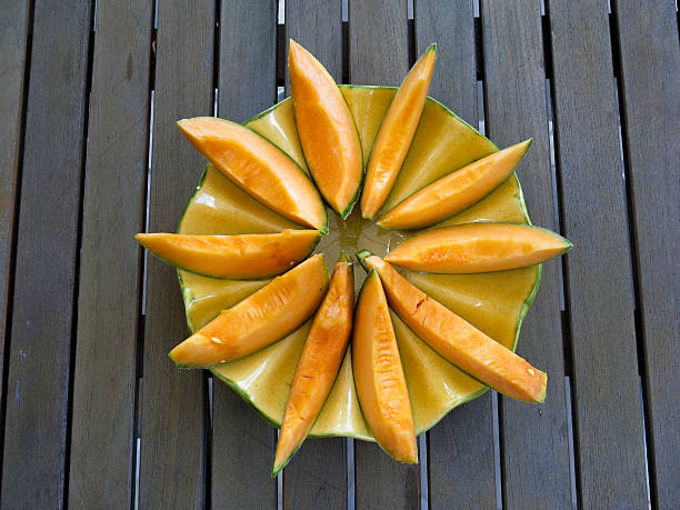 Slices of cantaloupe arranged in a circle stock photo