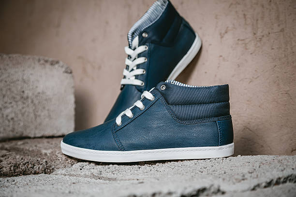 istock Men's shoes, sneakers on nature 487582794