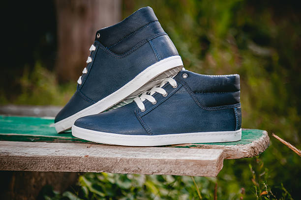 istock Men's shoes, sneakers on nature 487584474