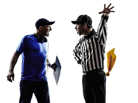 american football referee and coach conflict dispute conflict dispute in silhouettes on white background