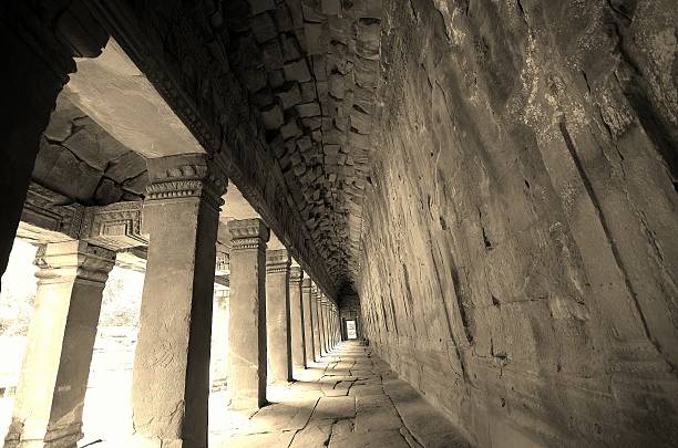 istock Long gray corridor with light at the end of 487585395
