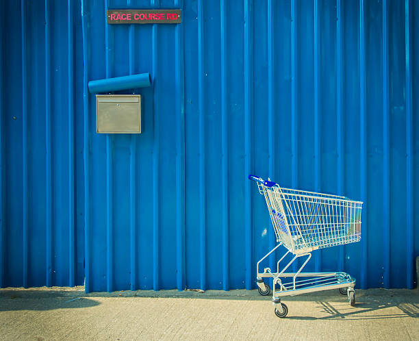 Shopping cart leave beside the street stock photo