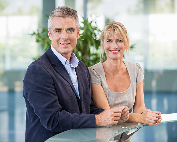 istock Business People At Hotel Reception Counter 487586315